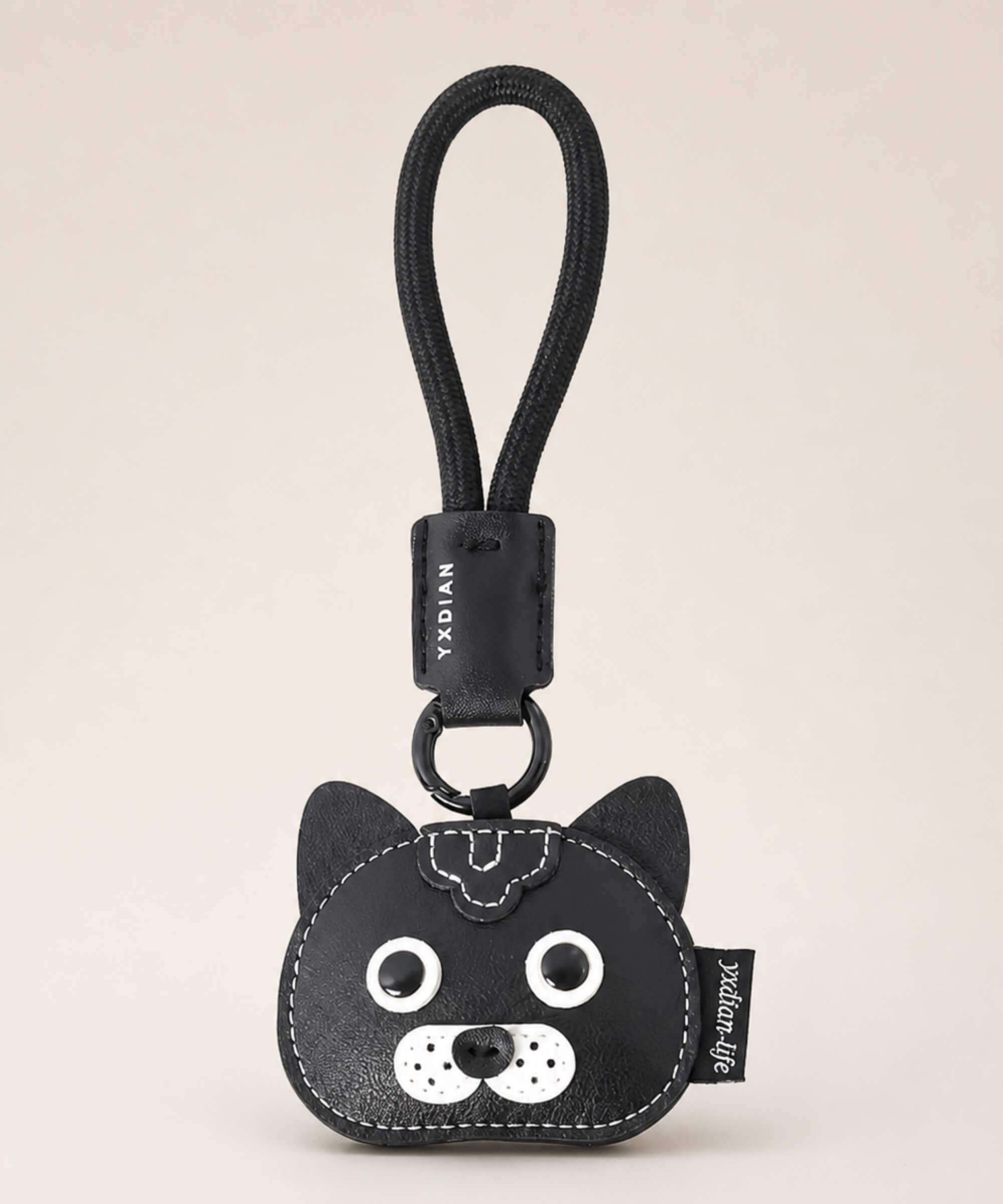 Black cat pet face PU leather bag charm keychain on a neutral background.